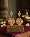 Gold Finish Stone Studded Dome Jhumka Earrings