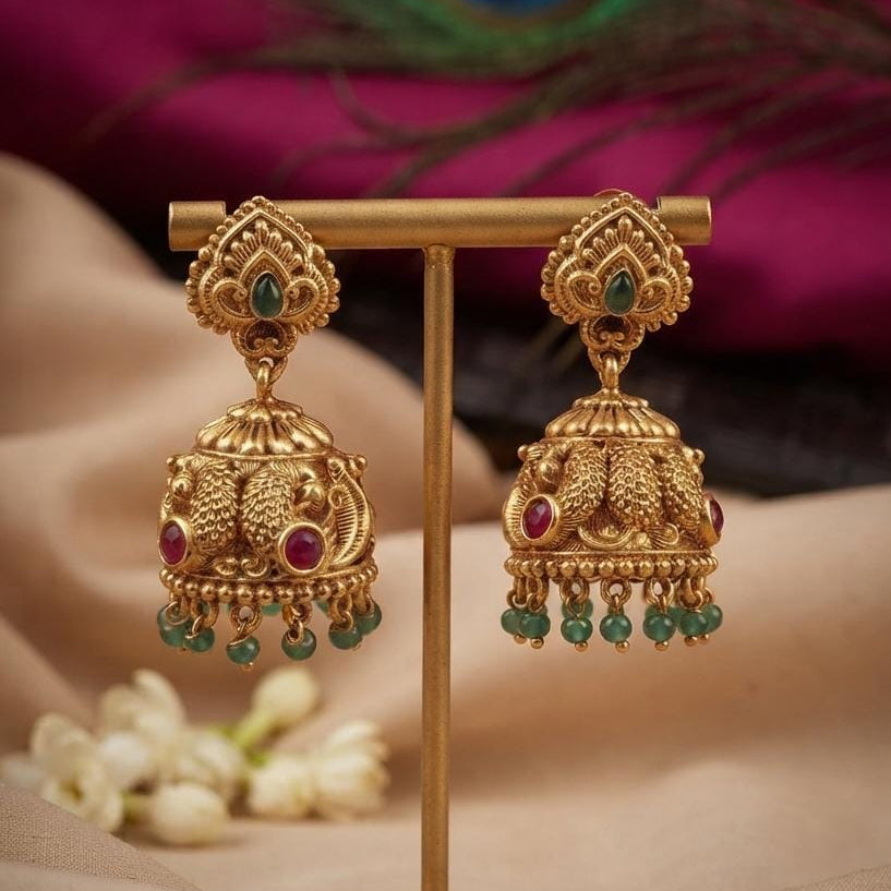Gold Finish Lakshmi Jhumka Earrings with Green Accents