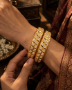 Gold Finish White Stone Leaf Pattern Bangle